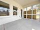 Covered screened-in porch with concrete flooring at 1327 Fern Ridge Ct # 27, Norcross, GA 30093
