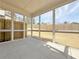 View from inside a screened-in porch showcasing a yard at 1327 Fern Ridge Ct # 27, Norcross, GA 30093