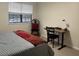 Bright bedroom with a work desk, chair, and cozy bed by a large window at 475 Mount Vernon Ne Hwy, Atlanta, GA 30328