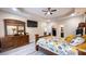 View of bedroom with wood furniture and a doorway to the bathroom and walk-in closet at 7460 Highway 101, Rockmart, GA 30153