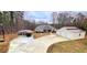 Charming home featuring a spacious driveway, carport, garage, and well-manicured lawn at 7460 Highway 101, Rockmart, GA 30153