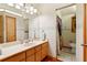 Neutral bathroom with a large mirror, vanity with ample storage, and a separate toilet area at 2513 Overlake Ln, Stockbridge, GA 30281