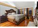 Beautiful bedroom features a king bed, wood floors, and glass doors leading to an outdoor space at 2513 Overlake Ln, Stockbridge, GA 30281