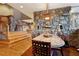 Elegant dining room boasts a stone accent wall, hardwood floors, and an eye-catching light fixture at 2513 Overlake Ln, Stockbridge, GA 30281