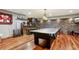 Finished basement game room with a pool table, kitchenette, bar, and stone accent wall at 2513 Overlake Ln, Stockbridge, GA 30281