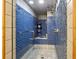 Modern shower room showcases mosaic tile walls, a glass door, and dual shower heads at 2513 Overlake Ln, Stockbridge, GA 30281