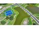 Aerial view of tennis courts with a pond at 4118 Haleston Rd, Duluth, GA 30097