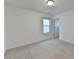 Bright bedroom features neutral walls, new carpet, and a window providing natural light at 4118 Haleston Rd, Duluth, GA 30097