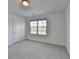 Bedroom features neutral walls, new carpet, and a window providing natural light at 4118 Haleston Rd, Duluth, GA 30097