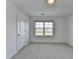 Bedroom with new carpet, neutral walls, and a bright window at 4118 Haleston Rd, Duluth, GA 30097