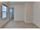 Bedroom with neutral walls, new carpet, and a door leading to the bathroom at 4118 Haleston Rd, Duluth, GA 30097