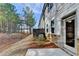 Exterior side view of townhome unit with a stone-accented patio at 4118 Haleston Rd, Duluth, GA 30097