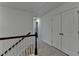 Hallway features include a neutral carpet and a stairway with a classic white banister and stained wood handrail at 4118 Haleston Rd, Duluth, GA 30097