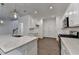 Bright kitchen with stainless appliances, a large center island with a sink and hardwood floors with staircase at 4118 Haleston Rd, Duluth, GA 30097