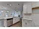 Bright, modern kitchen with a large island, stylish pendant lights, and stainless steel appliances at 4118 Haleston Rd, Duluth, GA 30097