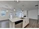 Bright kitchen featuring a large island, stainless steel dishwasher, and modern pendant lighting at 4118 Haleston Rd, Duluth, GA 30097