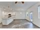 Open concept living area with hardwood floors and modern kitchen with stainless appliances and bright with lots of natural light at 4118 Haleston Rd, Duluth, GA 30097