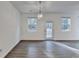 Bright living room featuring hardwood floors, abundant natural light, and a contemporary light fixture at 4118 Haleston Rd, Duluth, GA 30097