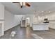 Bright, open-concept living room featuring hardwood floors and seamless flow into a modern kitchen with white cabinetry at 4118 Haleston Rd, Duluth, GA 30097