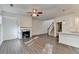 Bright open-concept living room, featuring a fireplace, hardwood floors and natural light at 4118 Haleston Rd, Duluth, GA 30097