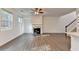 Bright open-concept living room, featuring a fireplace and hardwood floors at 4118 Haleston Rd, Duluth, GA 30097