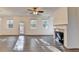 Spacious living room with a cozy fireplace, and large windows at 4118 Haleston Rd, Duluth, GA 30097