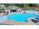 Community pool featuring a splash pad, lounge chairs, and shaded picnic tables at 4118 Haleston Rd, Duluth, GA 30097