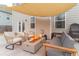 Back patio featuring a fire pit and ample seating at 4480 Sunflower Cir, Cumming, GA 30040