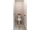 Cozy half-bathroom with gray tile floors at 4480 Sunflower Cir, Cumming, GA 30040