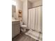 Neutral bathroom with gray vanity, framed wall art, and shower-tub combination at 4480 Sunflower Cir, Cumming, GA 30040