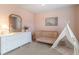 Charming Bedroom with crib, teepee, dresser, and soft pink accents for a cozy and comforting feel at 4480 Sunflower Cir, Cumming, GA 30040