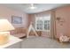 Adorable Bedroom featuring a crib, play tent, and neutral decor for a calming and inviting space at 4480 Sunflower Cir, Cumming, GA 30040
