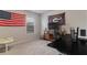 This bedroom is perfect for work or play, with an American flag, TV, desk and University of Georgia decor at 4480 Sunflower Cir, Cumming, GA 30040