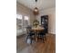 Cozy dining area with wood table, black chairs, and a modern light fixture at 4480 Sunflower Cir, Cumming, GA 30040