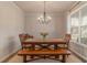 Elegant dining room with a wood table, comfortable seating, and modern chandelier lighting at 4480 Sunflower Cir, Cumming, GA 30040