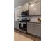 Modern kitchen featuring stainless steel appliances, granite countertops, and ample cabinet space at 4480 Sunflower Cir, Cumming, GA 30040