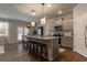 Stylish kitchen with a granite island, stainless steel appliances, and gray cabinets at 4480 Sunflower Cir, Cumming, GA 30040