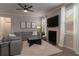 Comfortable living room featuring a gray sectional sofa, fireplace, and large TV at 4480 Sunflower Cir, Cumming, GA 30040