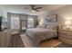 Bright main bedroom with a ceiling fan, lots of natural light, and neutral decor at 4480 Sunflower Cir, Cumming, GA 30040
