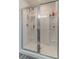 Bright white shower with sliding glass door at 4480 Sunflower Cir, Cumming, GA 30040