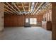 Unfinished basement with exposed beams and concrete walls at 7290 Weber St, Atlanta, GA 30349