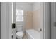 Bathroom featuring a shower over tub combo with tile surround at 7290 Weber St, Atlanta, GA 30349