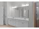 Bathroom featuring a large double vanity, new lighting, and shower stall at 7290 Weber St, Atlanta, GA 30349
