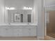 Bathroom featuring a large double vanity, new lighting, and shower stall at 7290 Weber St, Atlanta, GA 30349