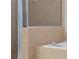 Close up of tiled shower and corner tub in bathroom at 7290 Weber St, Atlanta, GA 30349
