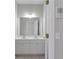 Bathroom features a double sink white vanity with tile floors and chrome hardware at 7290 Weber St, Atlanta, GA 30349