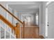 Open dining area with hardwood floors, mirrored wall, and view to the foyer staircase, creates an inviting space at 7290 Weber St, Atlanta, GA 30349