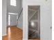 Open foyer with staircase and open door to unfinished space at 7290 Weber St, Atlanta, GA 30349
