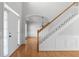Bright foyer features hardwood floors, a staircase, and a view into the dining room, creating an inviting entrance at 7290 Weber St, Atlanta, GA 30349