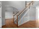 Grand foyer showcases a staircase and dining room, enhanced by hardwood flooring and decorative wall trim at 7290 Weber St, Atlanta, GA 30349